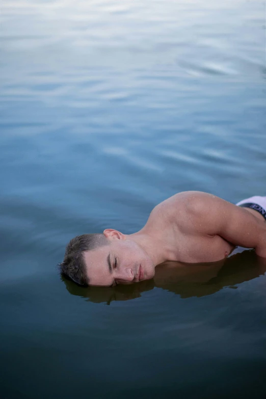  floating in a lake by himself