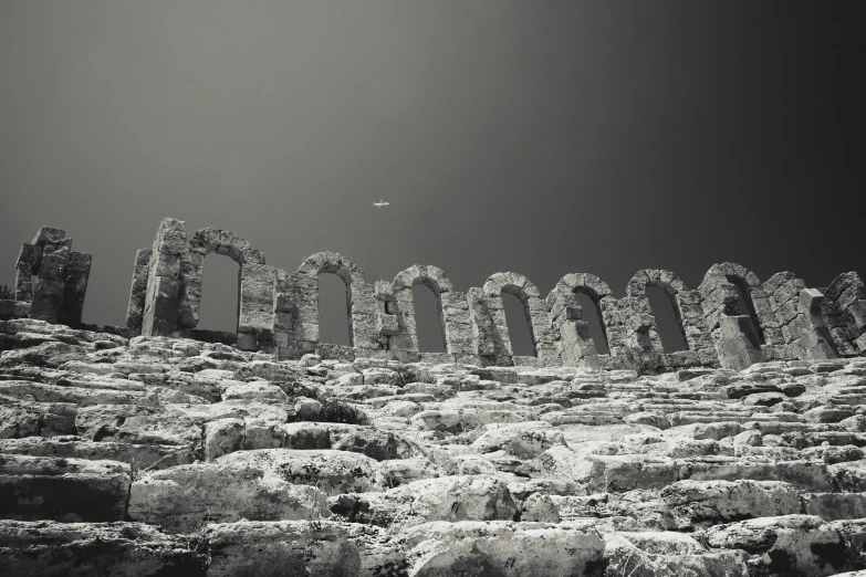 a black and white image of an ancient structure