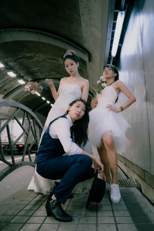 three young woman dressed in white and blue standing next to each other