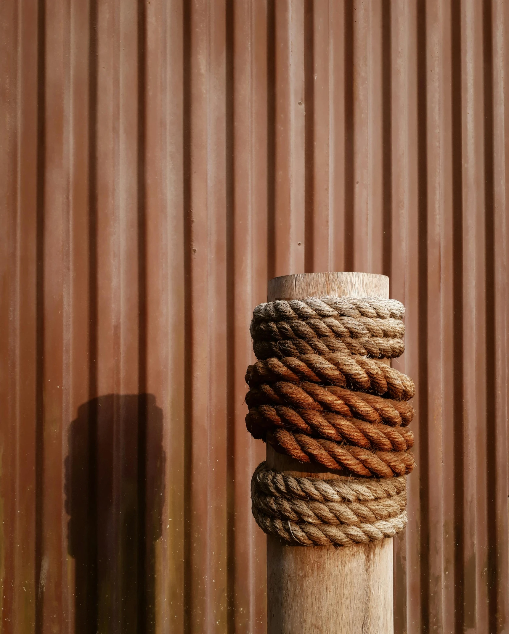 close up view of ropes against wall of warehouse