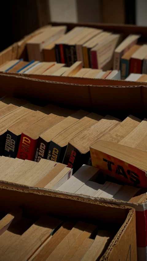 boxes of books are stacked and the lids are closed