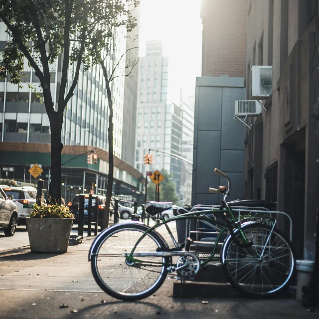 there is a bike parked on the side of the street