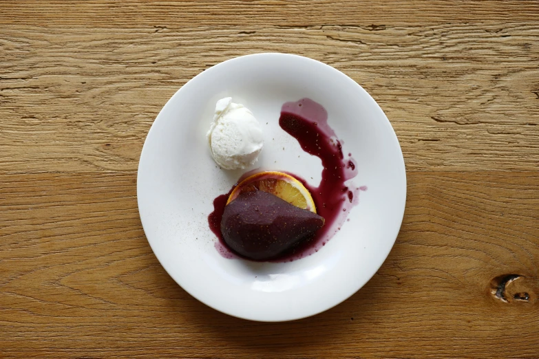 a plate topped with fruit and ice cream