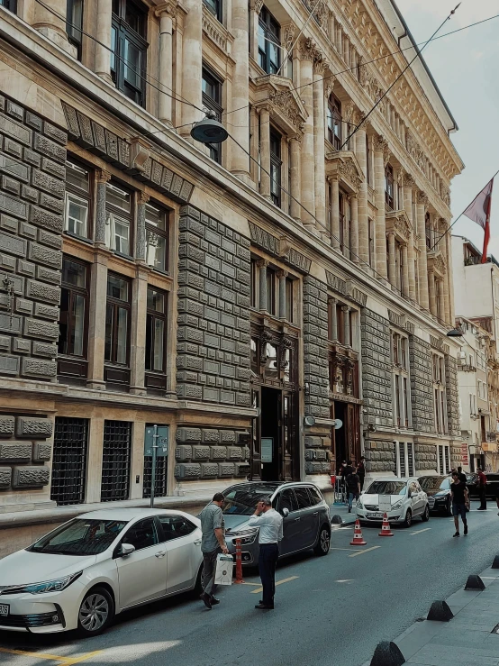 some cars and a person walking down the street