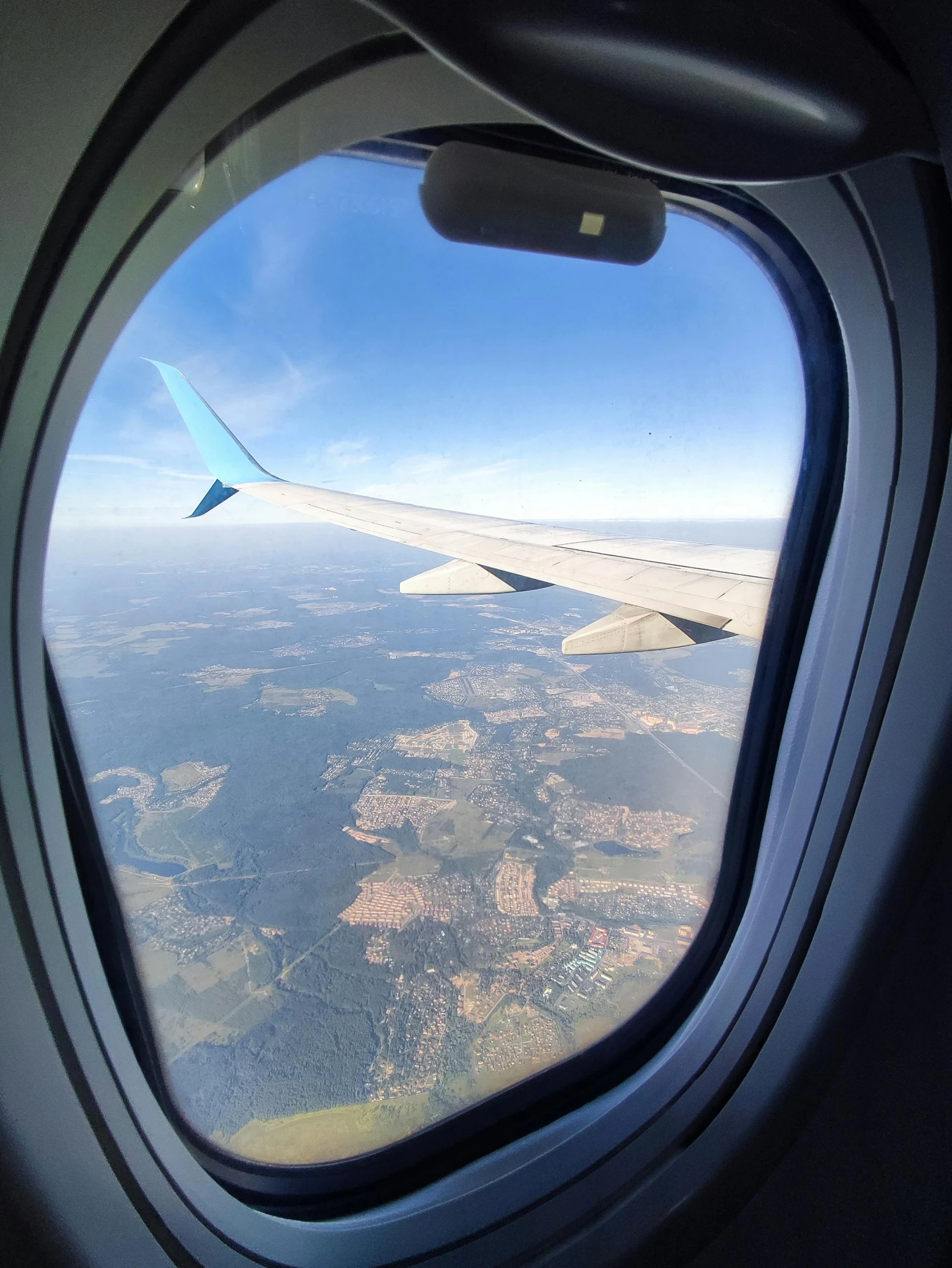 the view of an airplane wing taken from an aircraft window