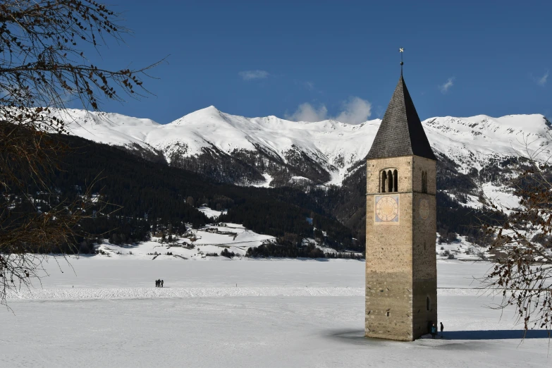 a tower stands out on the snowy slopes