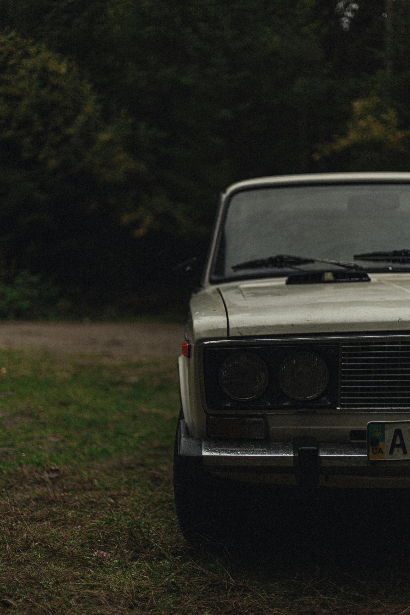 an old - time vehicle is parked in the grass