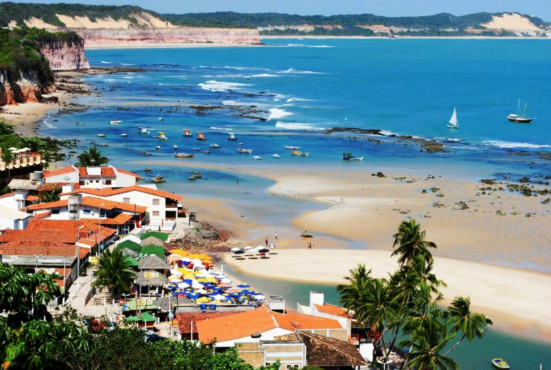 there are many boats parked on the beach