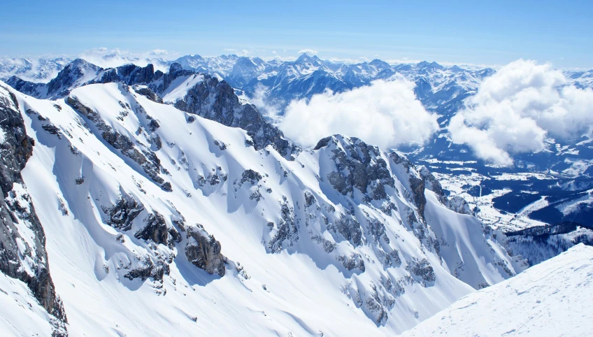 there is a view of a large mountain range from the top