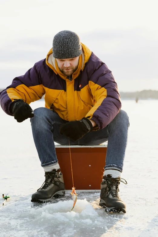 a man sits in a small area while fishing