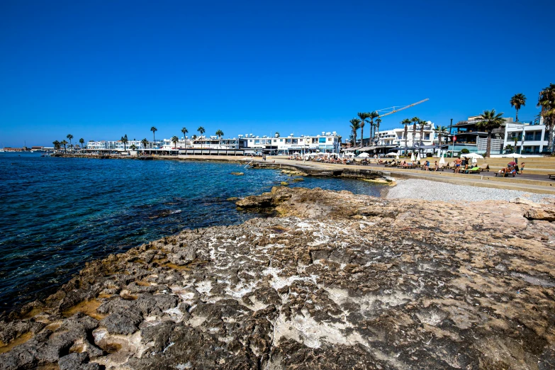 a view of a marina on the shore in an older city