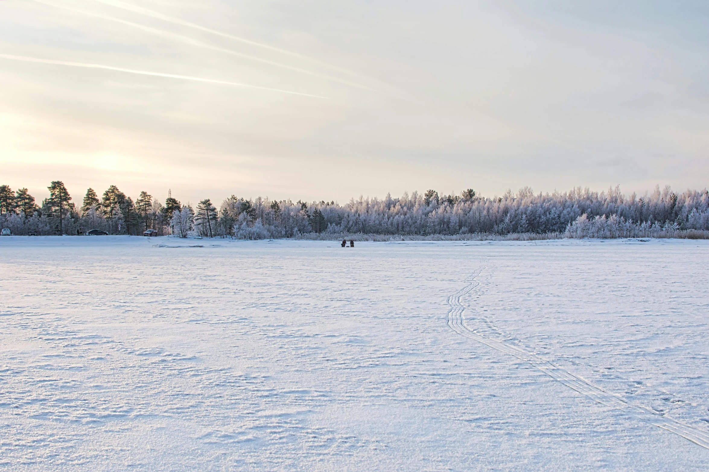 there is a path in the snow as people are walking around