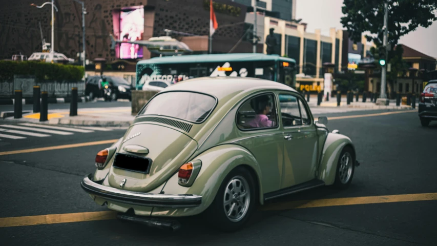 a car parked next to a sidewalk on the road