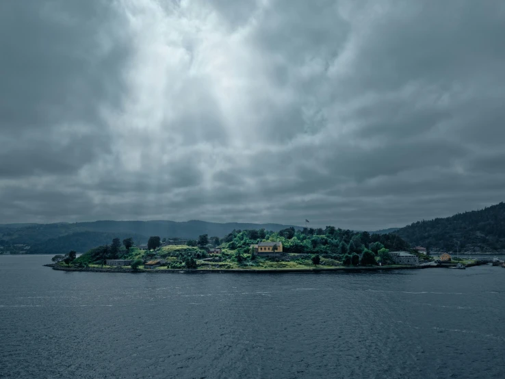 an island sits in the middle of a lake