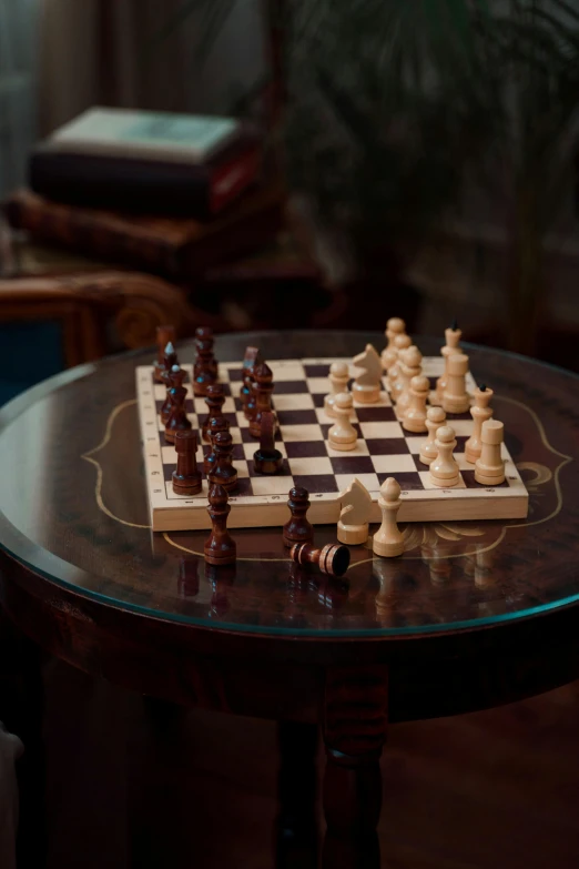 chess pieces sitting on top of a table next to each other