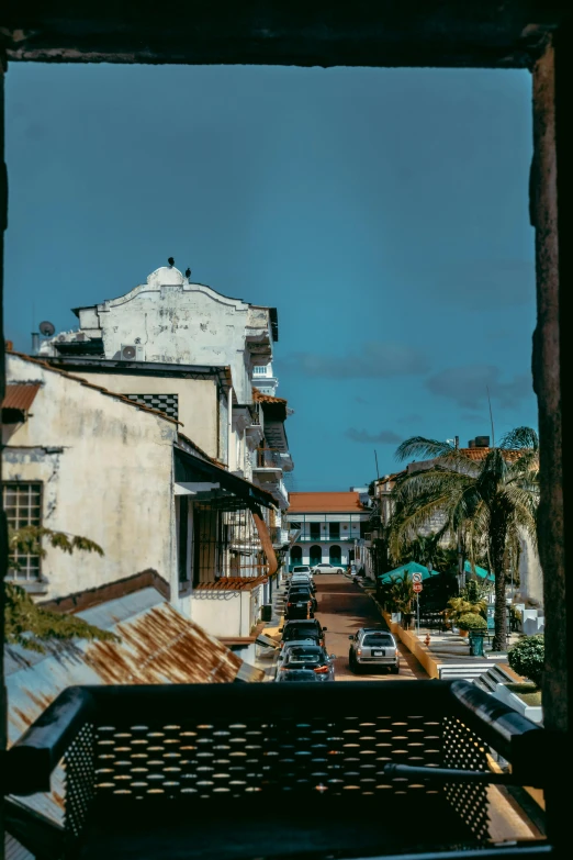 a bench and car on a city street