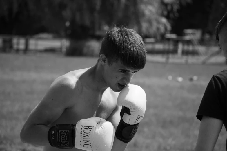 a  wearing gloves that say boxing