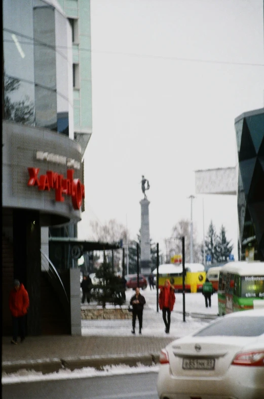 pedestrians cross the street in the city at night