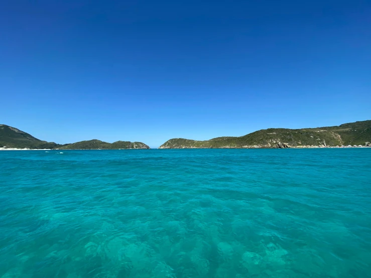 several small islands are in the distance on a clear day