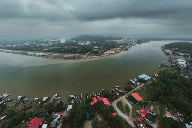 a very wide body of water next to a small city