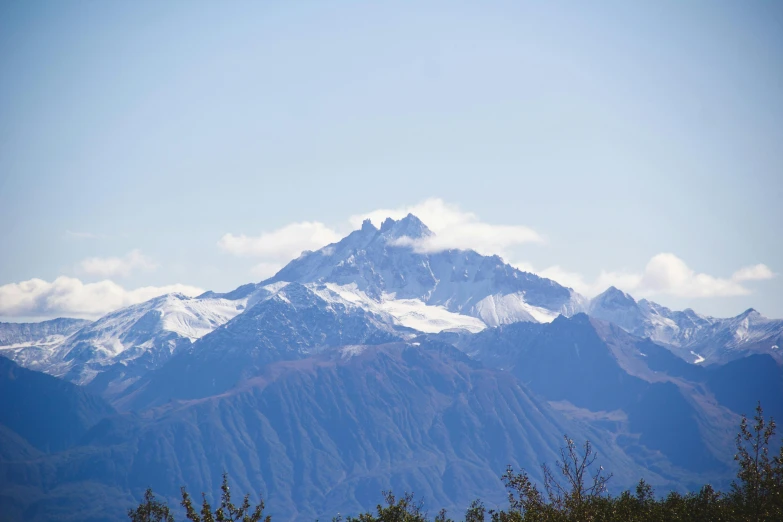 a tall mountain that has some snow on it