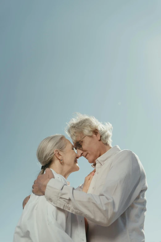 two women dressed in white facing each other