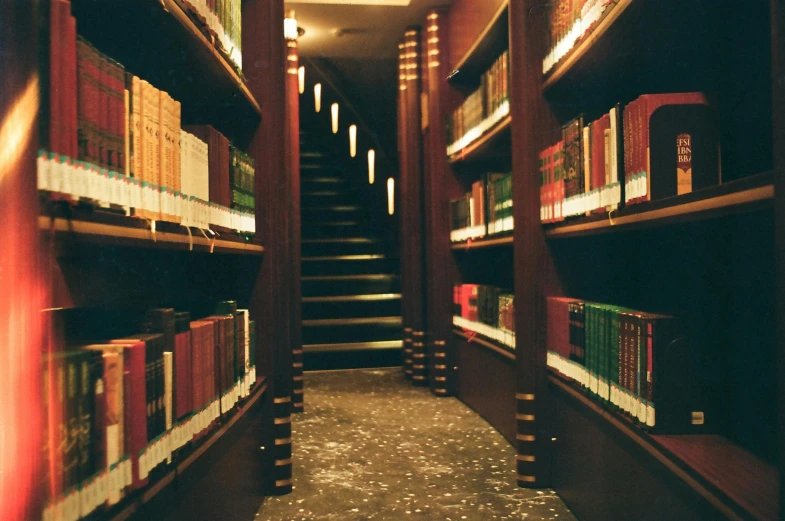 a room with a bunch of shelves full of books