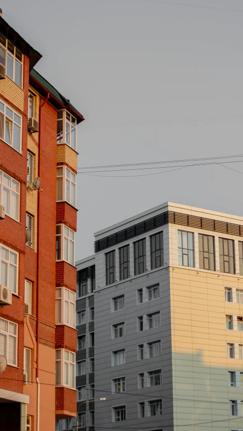 a street view of some buildings and wires