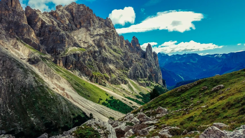 a hill in the mountains with some small rocks