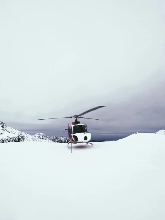 a helicopter that is sitting in the snow