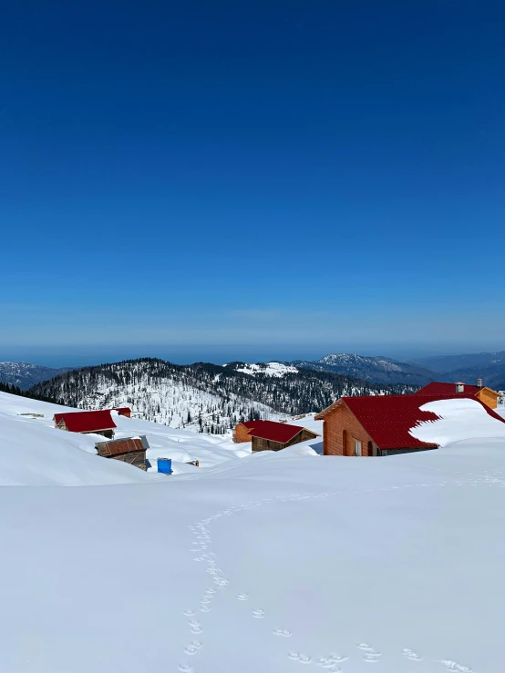 a man skiing down a mountain on a clear day