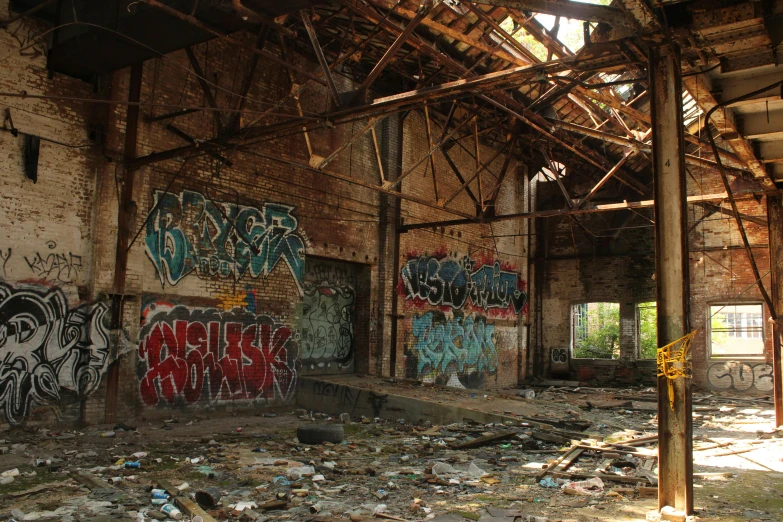an abandoned building that is in disrepair with graffiti