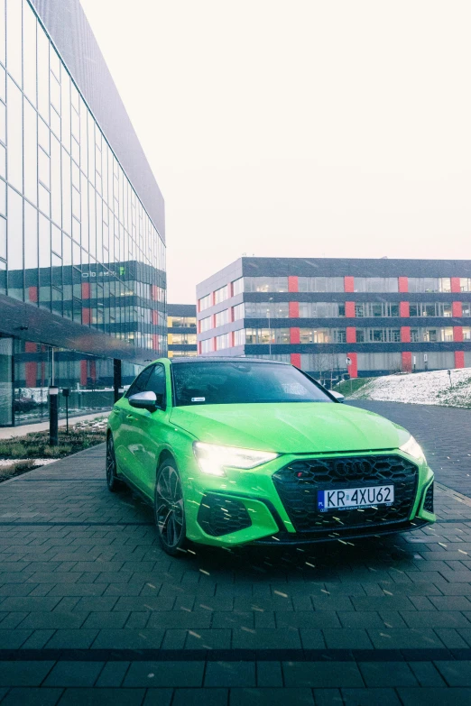 a lime green car sitting in the middle of a parking lot