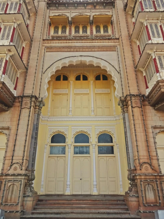 an old building has been converted into apartments and art deco