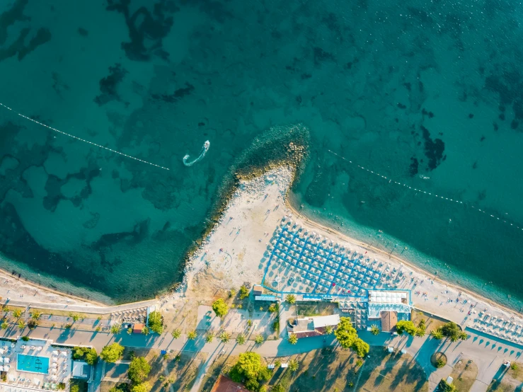 the aerial s shows an airport and beach from a high angle