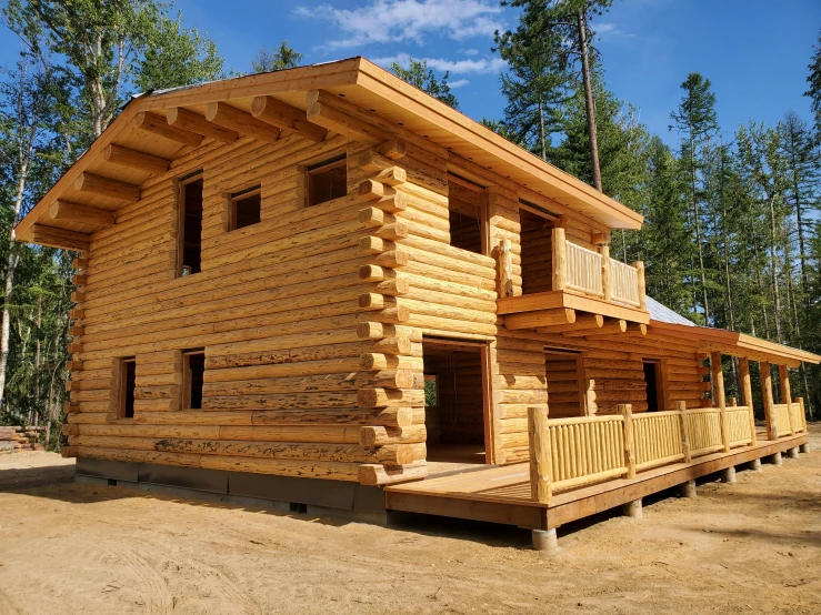 a large wooden log cabin is made of wood