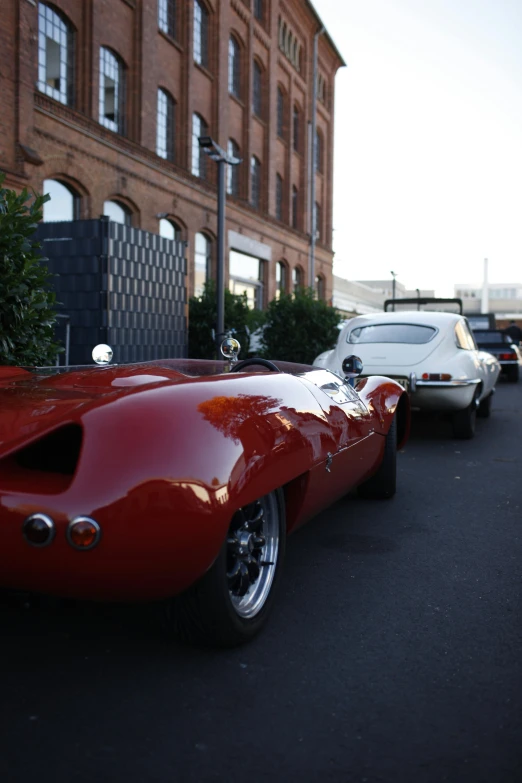 a vintage sports car on a city street