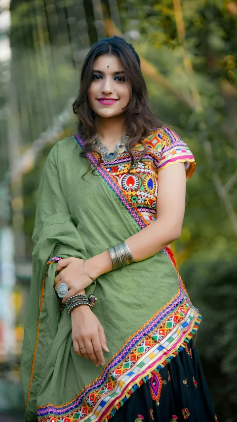 a beautiful woman wearing green in an ornate dress