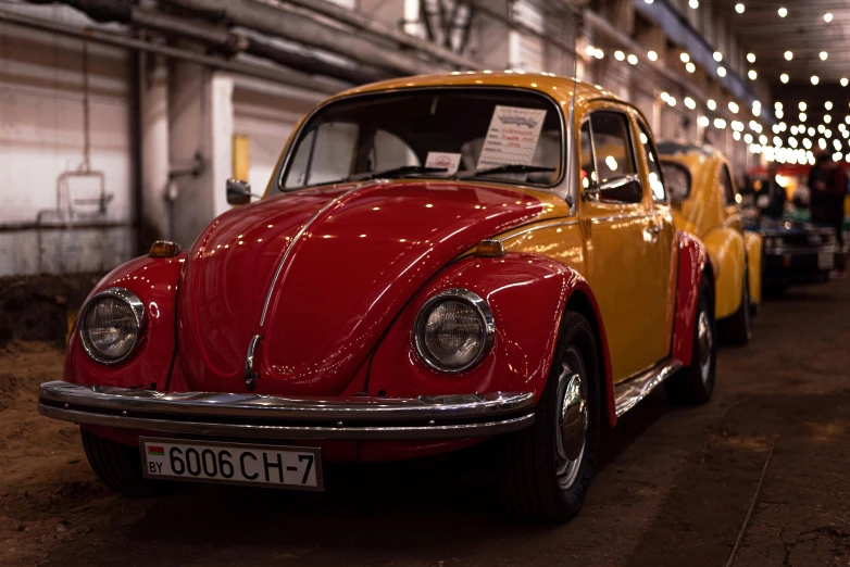 this is an old red and yellow beetle on display