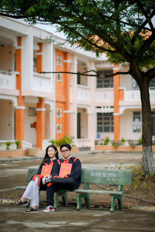 an image of two people sitting on a bench