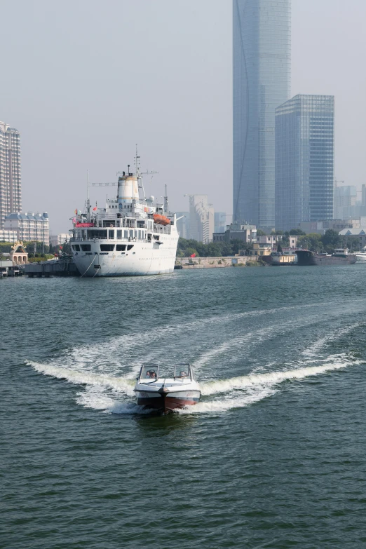 two boats on water near large buildings