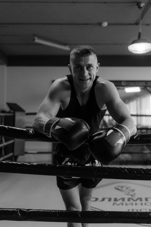 a black and white po of a boxer in the ring