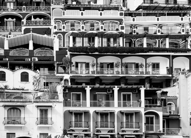 people walking through an intricate building pattern