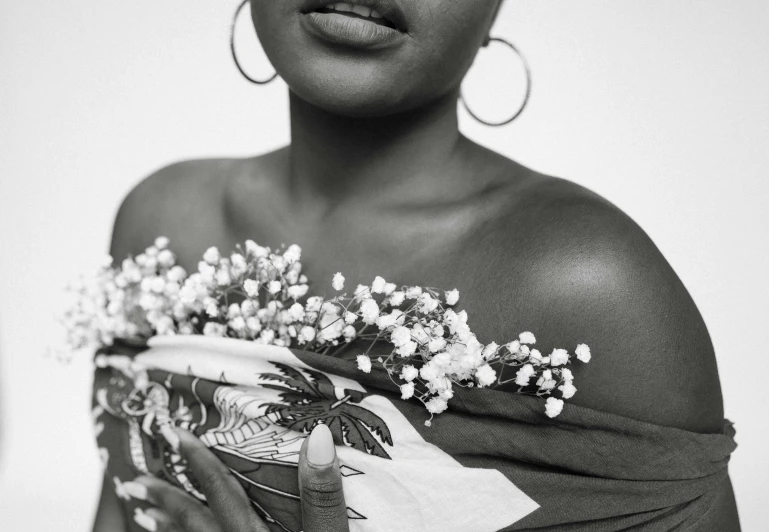 a woman that has flowers on her shoulder