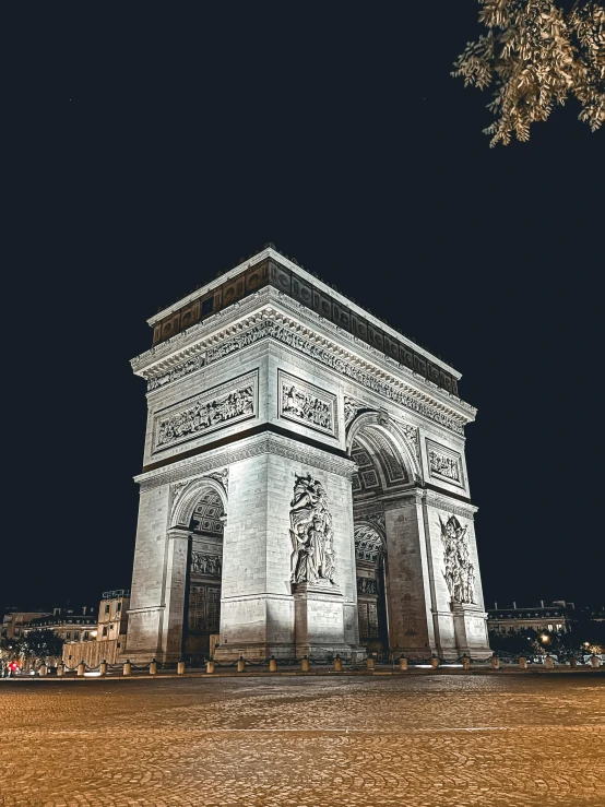 the white monument with intricate carving against black sky