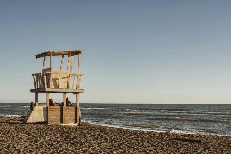 a lifeguard tower sitting on top of the beach