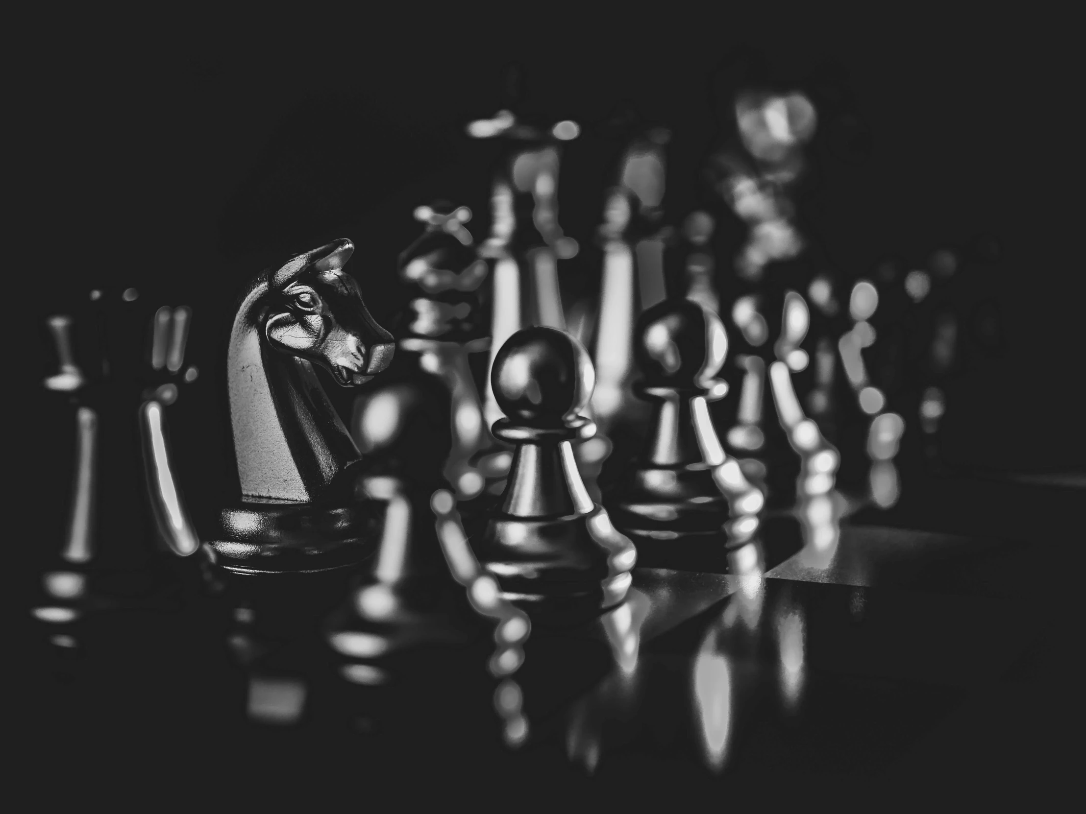 a chess game set up in black and white