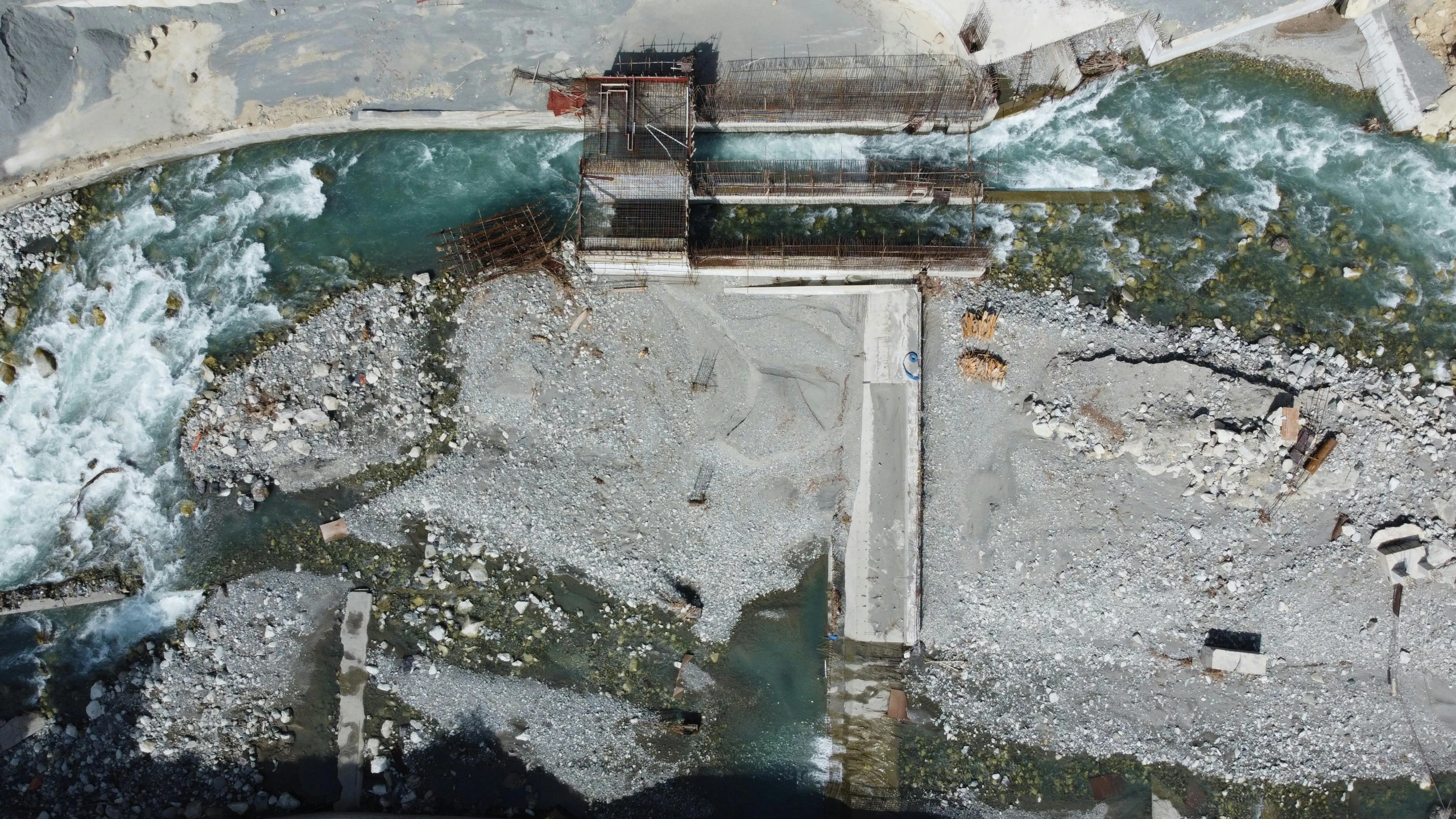 an aerial view of a dock and the ocean