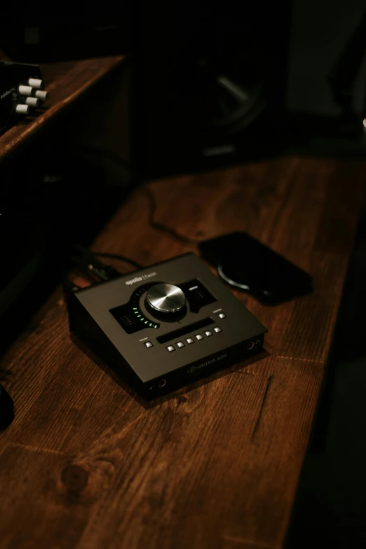 a remote sitting on top of a wooden table