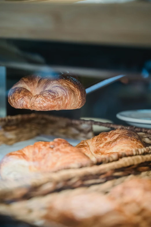 croissants cooking on an oven while being cooked